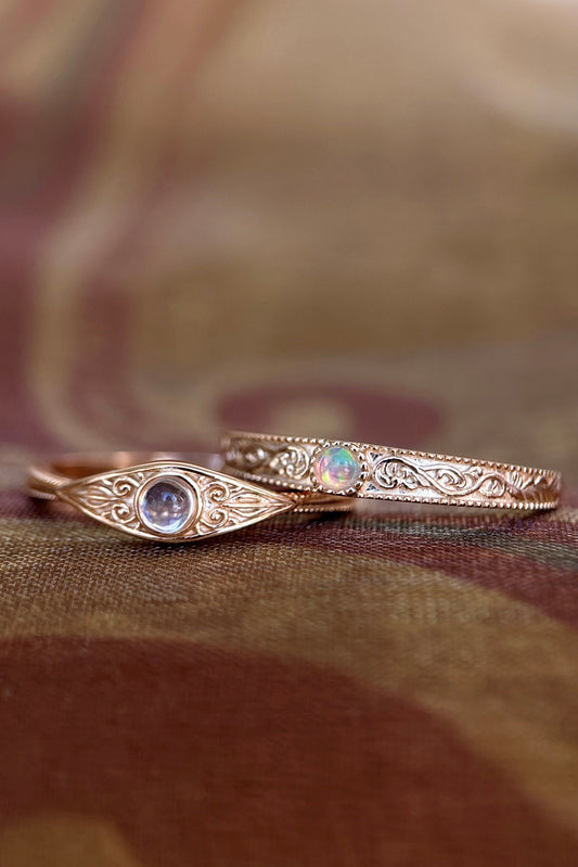 LIRAE moonstone ring featuring golden swirl filigree and an eye-shaped silhouette, ethereal vintage jewelry for women in gold.