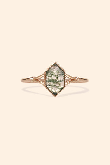 Moss agate ring with green inclusions on delicate gold band.