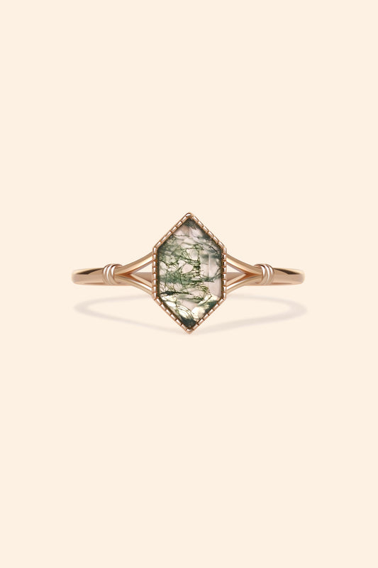Moss agate ring with green inclusions on delicate gold band.