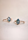 Moss agate ring with green inclusions on delicate gold band.
