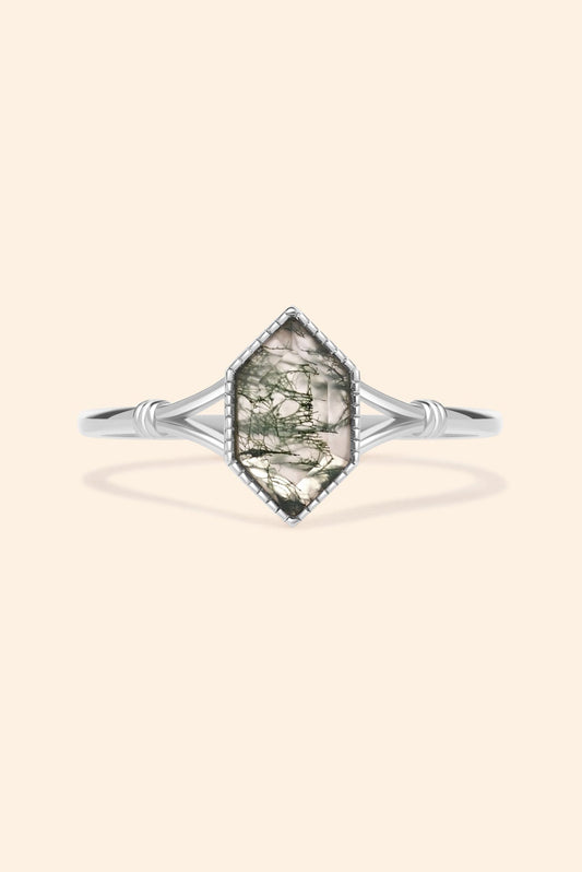 Moss agate ring with green inclusions on delicate silver band.