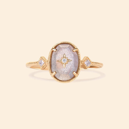 Bold 14k gold oval labradorite statement ring with a central starburst diamond motif and side diamond accents, vintage celestial relic jewelry by LIRAE.