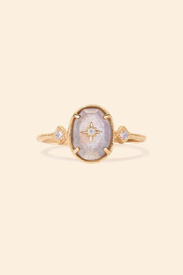 Bold 14k gold oval labradorite statement ring with a central starburst diamond motif and side diamond accents, vintage celestial relic jewelry by LIRAE.
