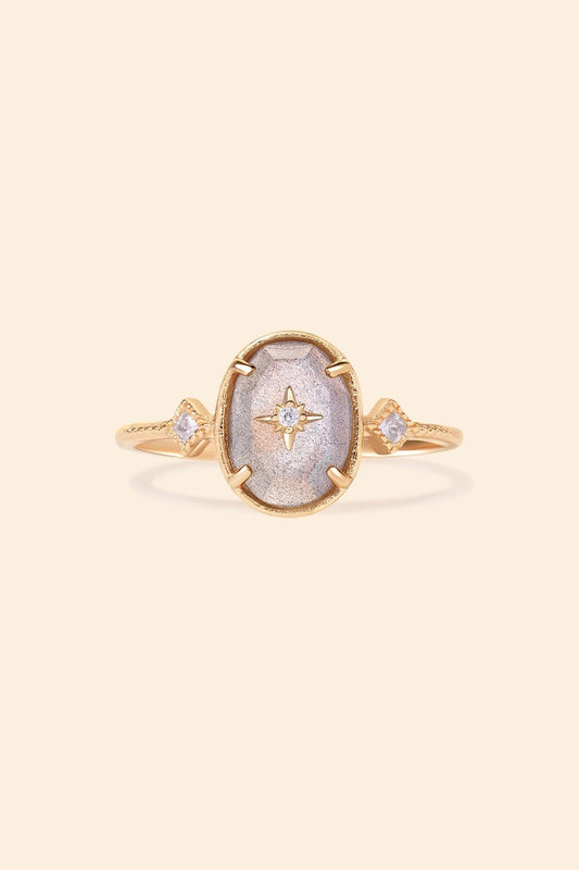 Bold 14k gold oval labradorite statement ring with a central starburst diamond motif and side diamond accents, vintage celestial relic jewelry by LIRAE.
