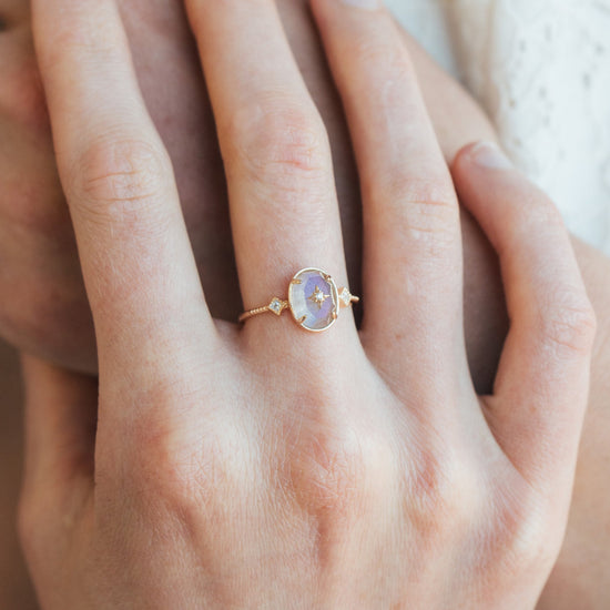 Bold 14k gold oval labradorite statement ring with a central starburst diamond motif and side diamond accents, vintage celestial relic jewelry by LIRAE.