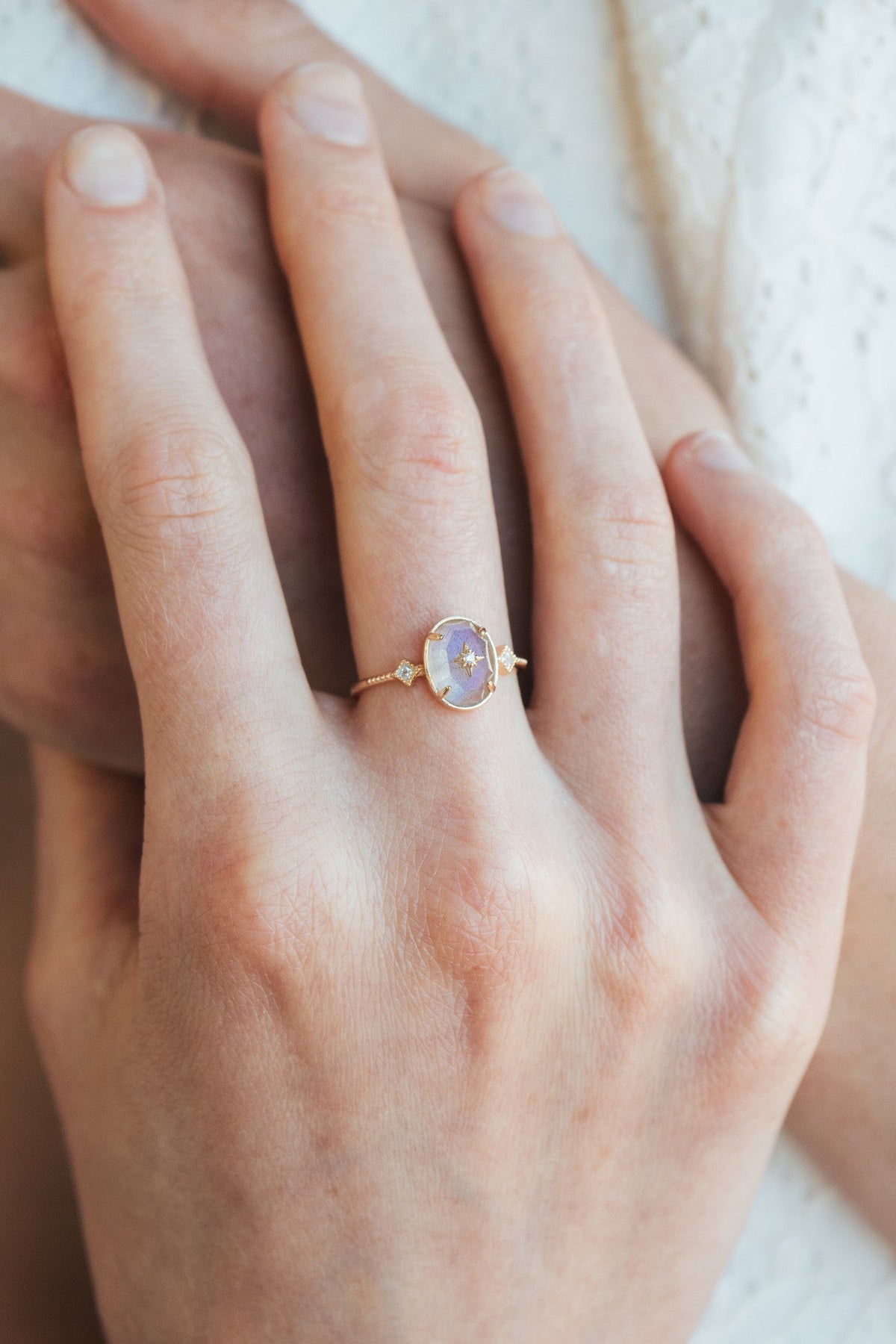 Bold 14k gold oval labradorite statement ring with a central starburst diamond motif and side diamond accents, vintage celestial relic jewelry by LIRAE.