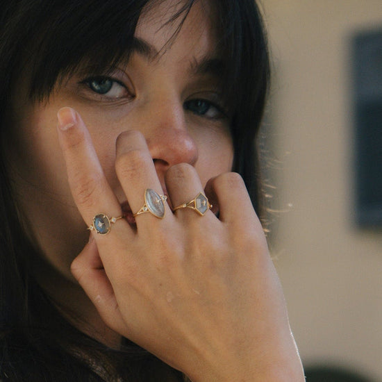 Bold 14k gold oval labradorite statement ring with a central starburst diamond motif and side diamond accents, vintage celestial relic jewelry by LIRAE.