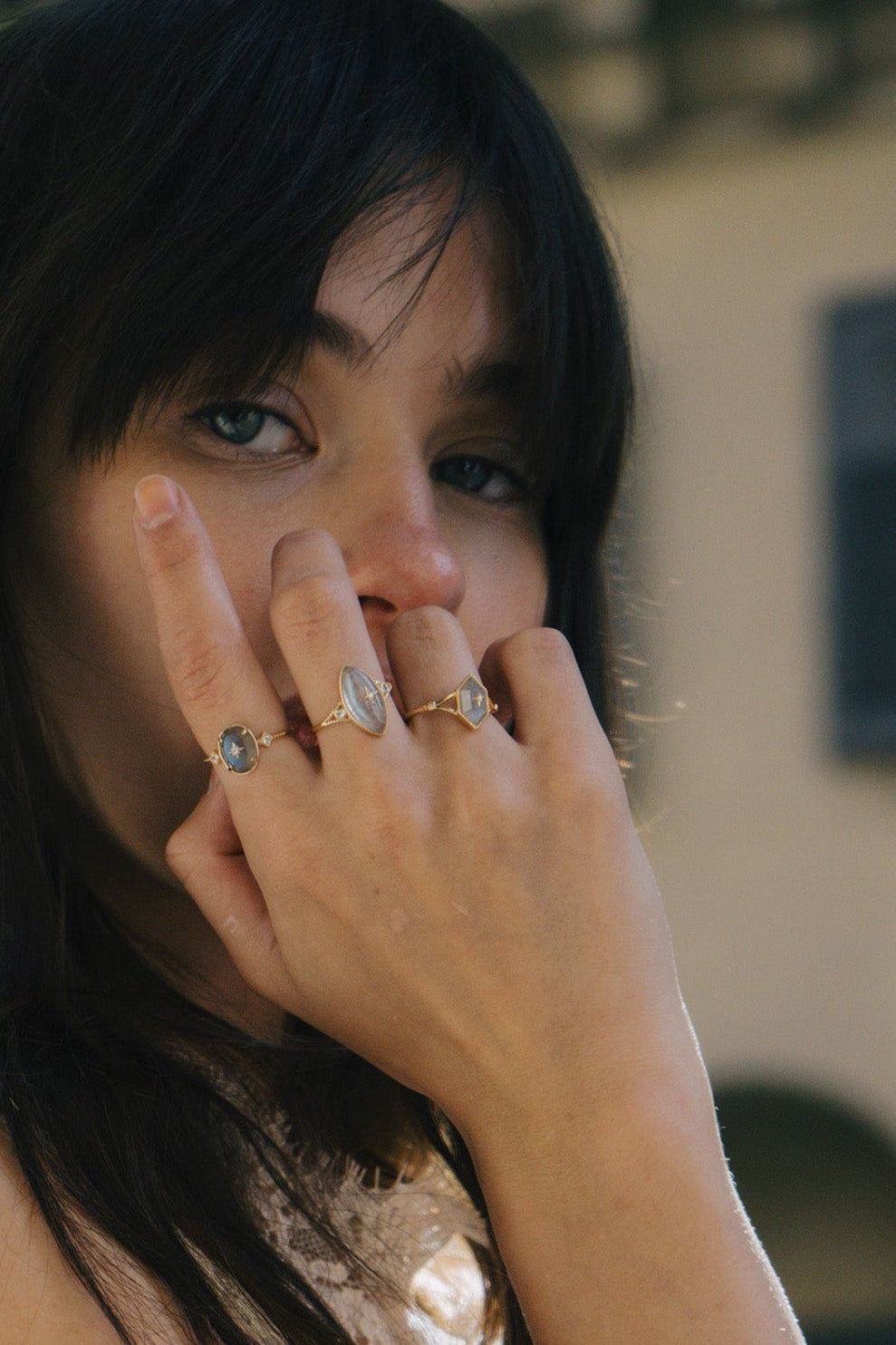 Bold 14k gold oval labradorite statement ring with a central starburst diamond motif and side diamond accents, vintage celestial relic jewelry by LIRAE.