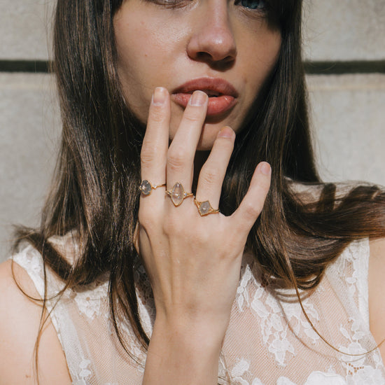 Bold 14k gold oval labradorite statement ring with a central starburst diamond motif and side diamond accents, vintage celestial relic jewelry by LIRAE.