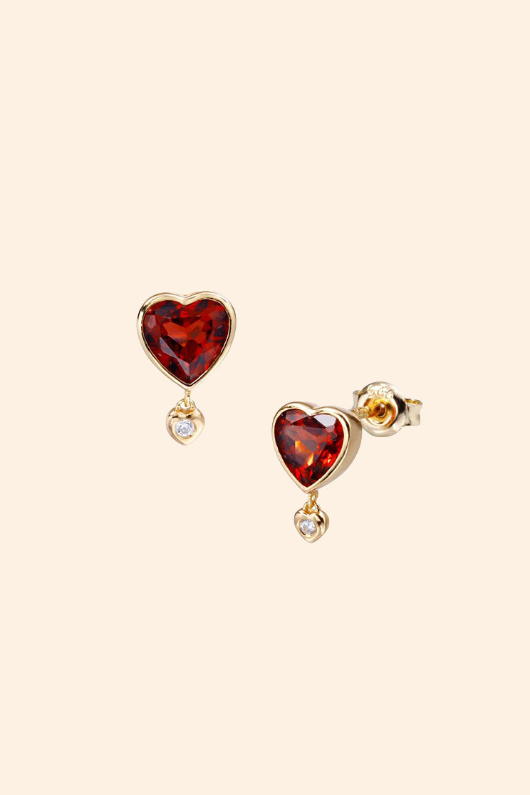 LIRAE vintage style gold heart earrings featuring heart-shaped garnet and a small diamond heart dangle, romantic jewelry for women.