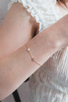 Dainty gold pavé moon phase bracelet with sparkling moon charms