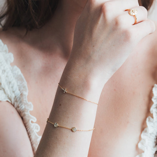 Dainty gold pavé moon phase bracelet with sparkling moon charms