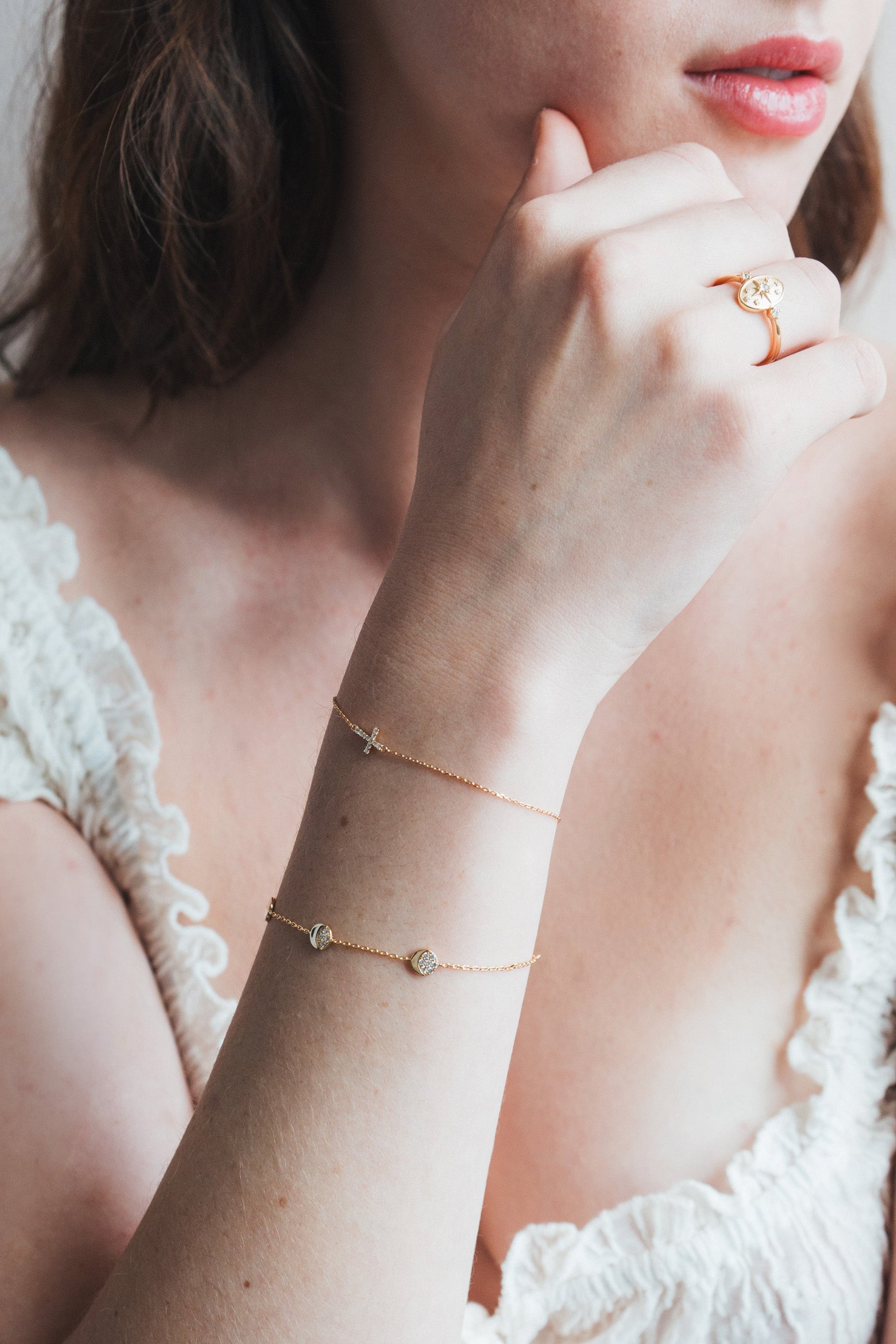 Dainty gold pavé moon phase bracelet with sparkling moon charms
