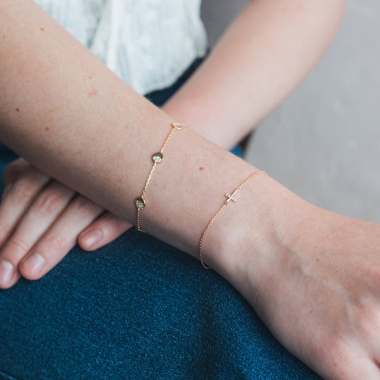 Dainty gold pavé moon phase bracelet with sparkling moon charms
