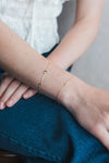 Dainty gold pavé moon phase bracelet with sparkling moon charms