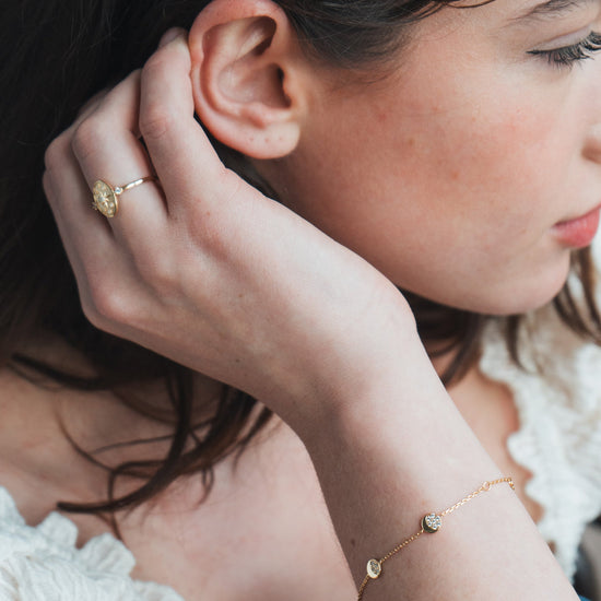 Dainty gold pavé moon phase bracelet with sparkling moon charms