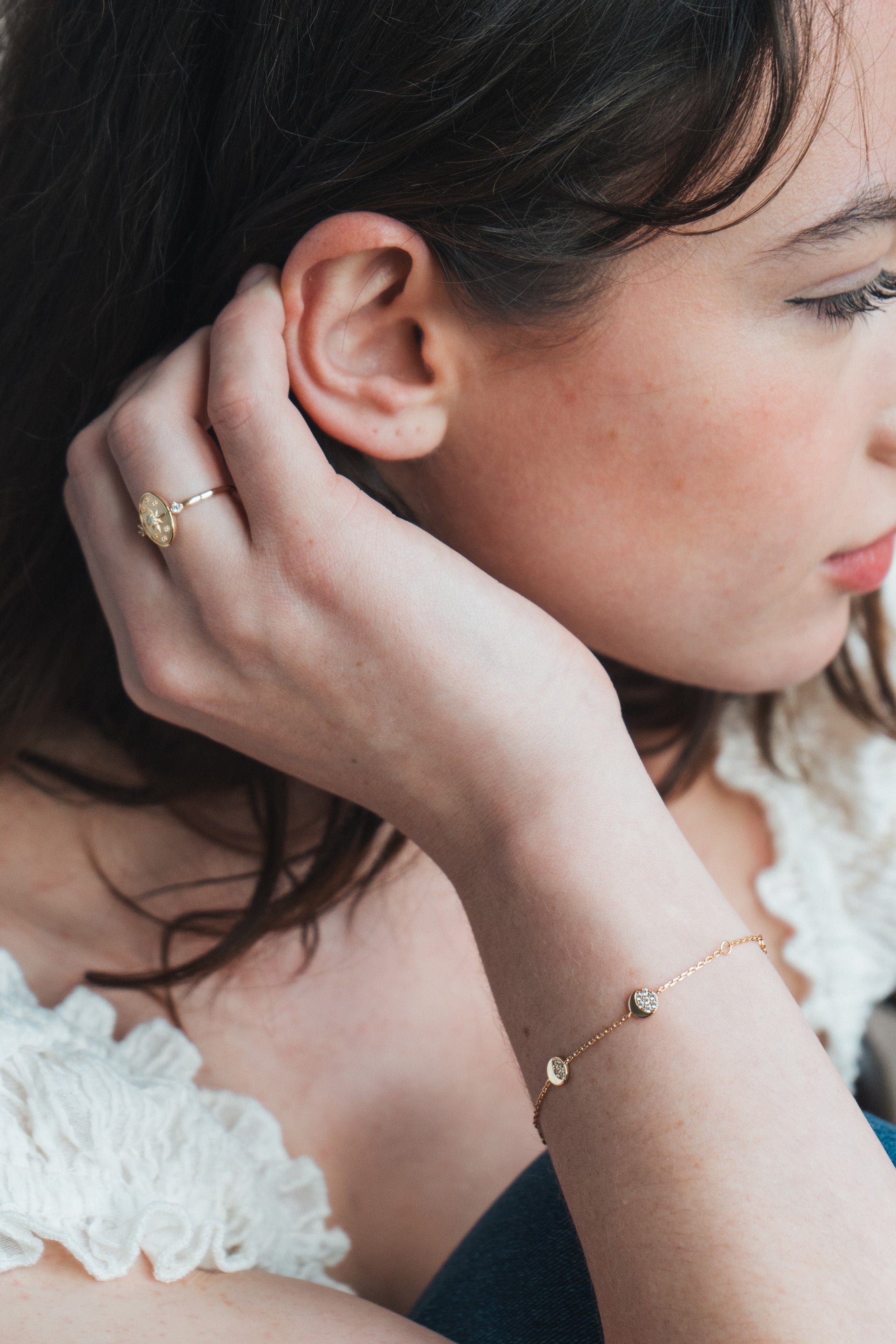 Dainty gold pavé moon phase bracelet with sparkling moon charms