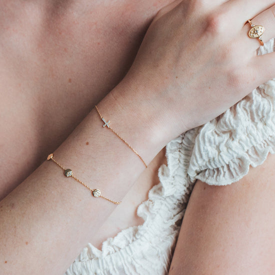 Dainty gold pavé moon phase bracelet with sparkling moon charms