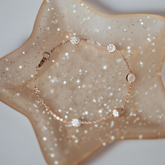 Dainty gold pavé moon phase bracelet with sparkling moon charms