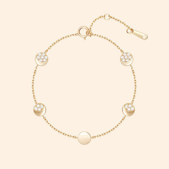 Dainty gold pavé moon phase bracelet with sparkling moon charms