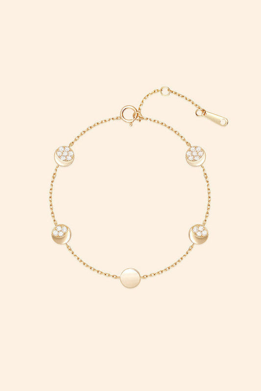 Dainty gold pavé moon phase bracelet with sparkling moon charms