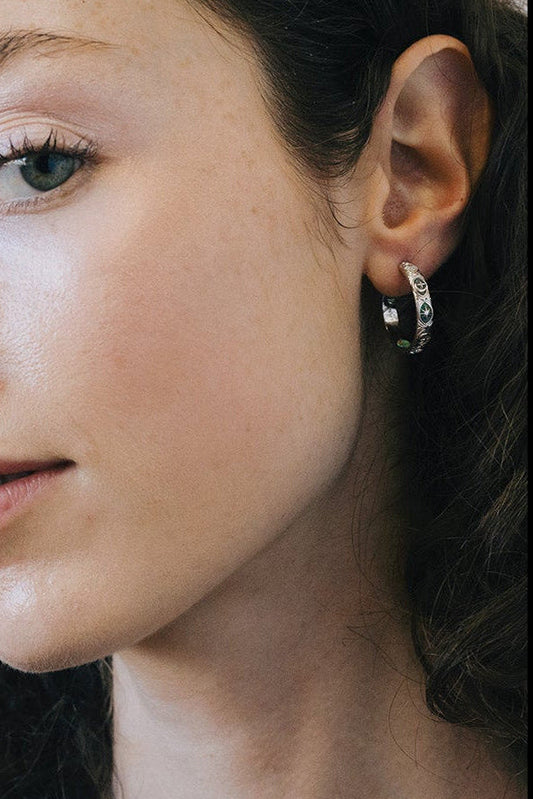 Silver medium hoop earrings with fire opal inlays and engraved sun moon and star details