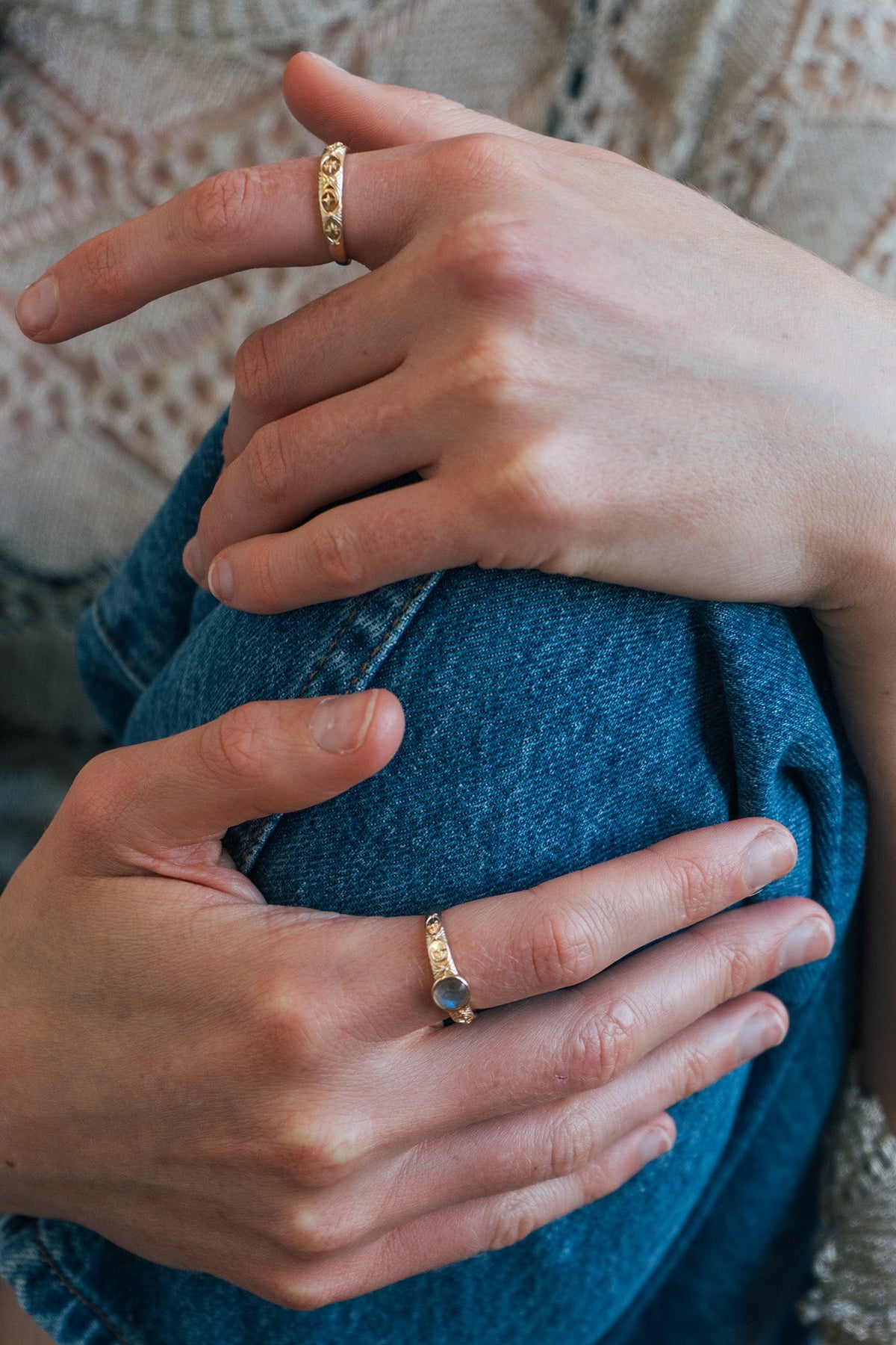 Gold celestial labradorite ring with round center stone and engraved star and moon details