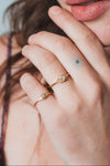 LIRAE vintage-inspired gold ring featuring a square-cut moissanite and sunburst radiant texture, geometric Art Deco jewelry for women.