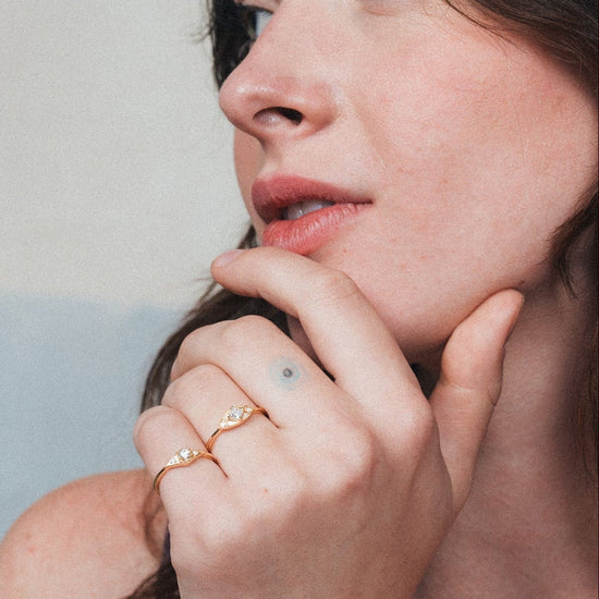 LIRAE vintage-inspired gold ring featuring a square-cut moissanite and sunburst radiant texture, geometric Art Deco jewelry for women.