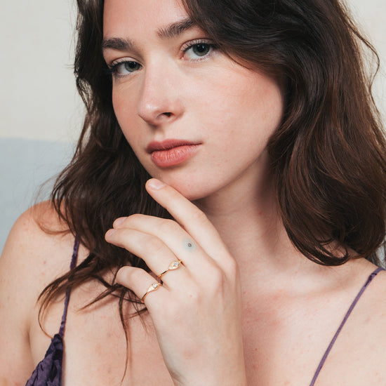 LIRAE vintage-inspired gold ring featuring a square-cut moissanite and sunburst radiant texture, geometric Art Deco jewelry for women.
