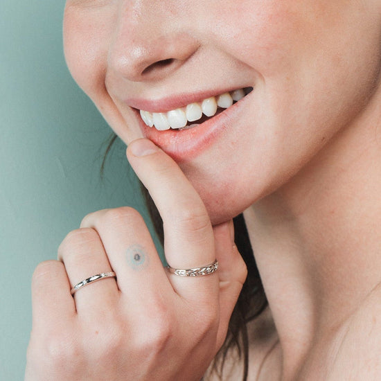 Silver ring with starburst engravings, celestial jewelry by LIRAE.