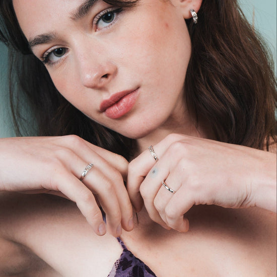 Silver ring with starburst engravings, celestial jewelry by LIRAE.