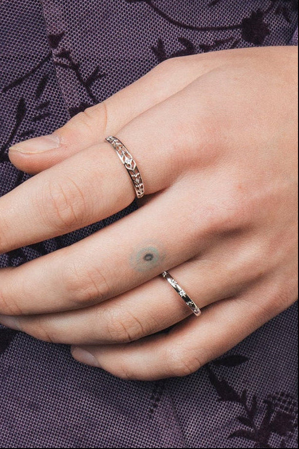 Silver ring with starburst engravings, celestial jewelry by LIRAE.