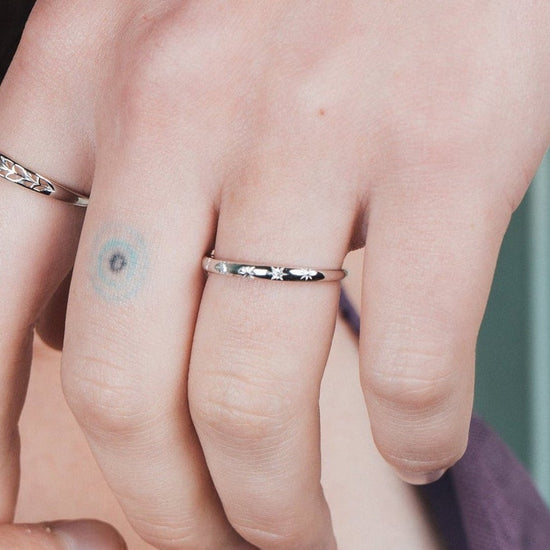 Silver ring with starburst engravings, celestial jewelry by LIRAE.