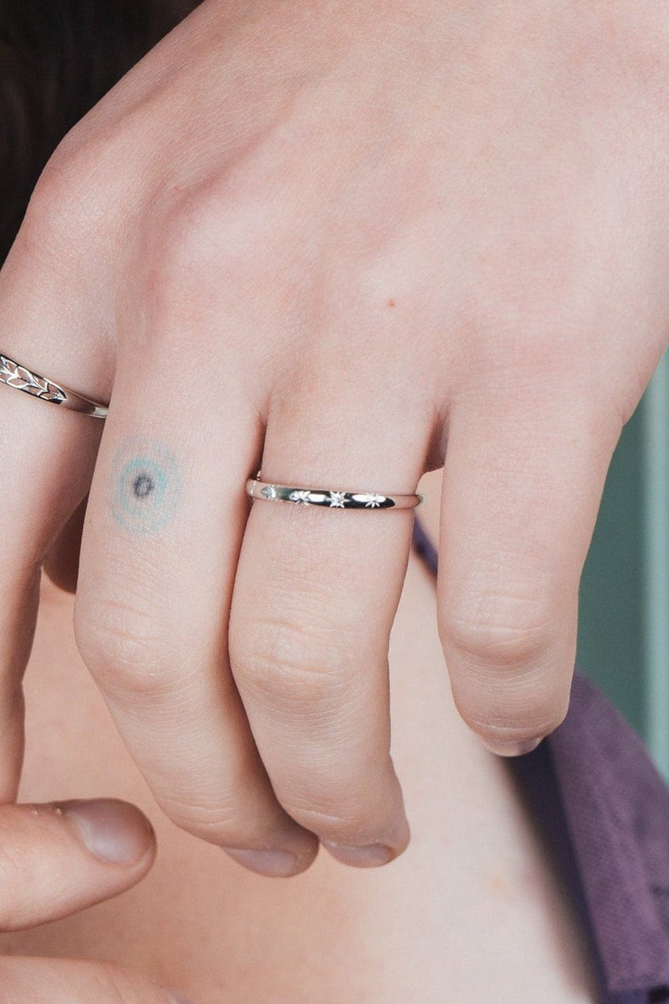 Silver ring with starburst engravings, celestial jewelry by LIRAE.