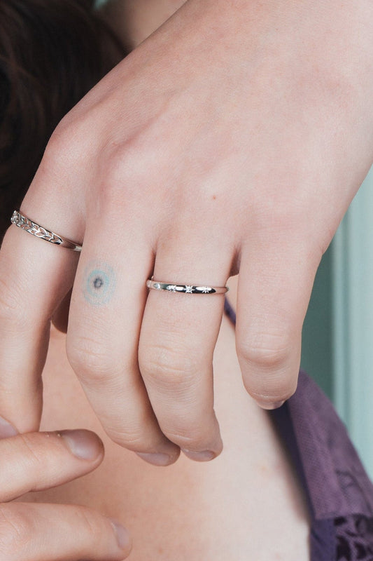 Silver ring with starburst engravings, celestial jewelry by LIRAE.