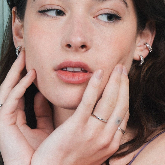 Silver ring with starburst engravings, celestial jewelry by LIRAE.