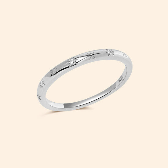 Silver ring with starburst engravings, celestial jewelry by LIRAE.