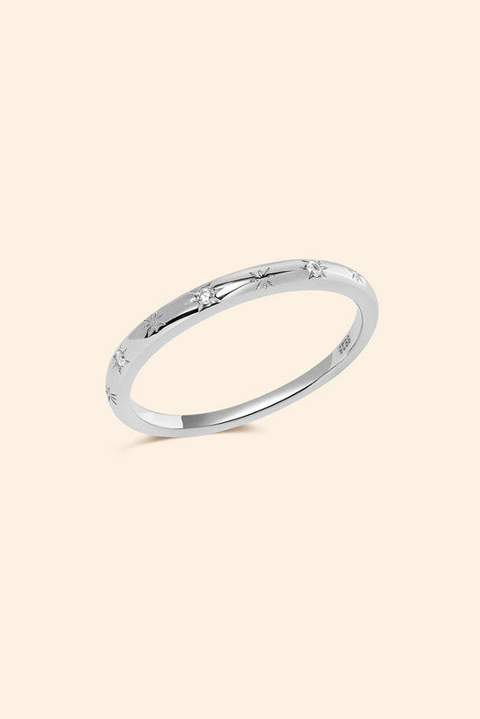 Silver ring with starburst engravings, celestial jewelry by LIRAE.