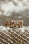 Intricately hollowed 14k gold eternity band with a central starburst diamond, celestial stacking ring by LIRAE.
