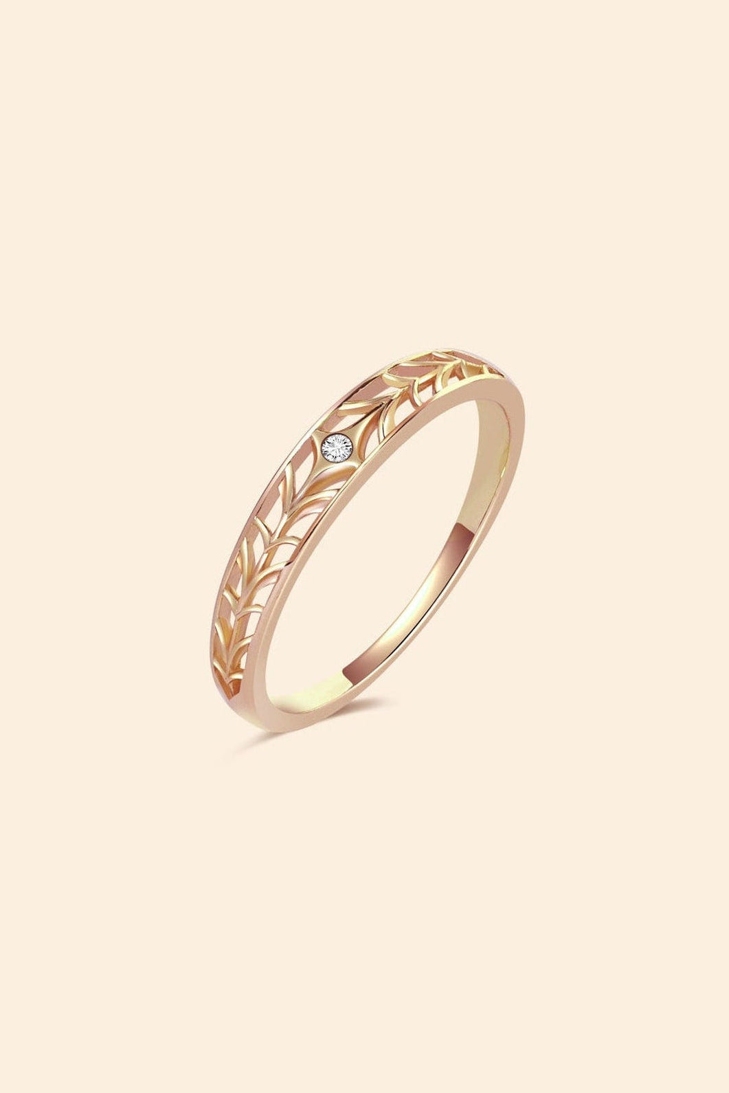 Intricately hollowed 14k gold eternity band with a central starburst diamond, celestial stacking ring by LIRAE.