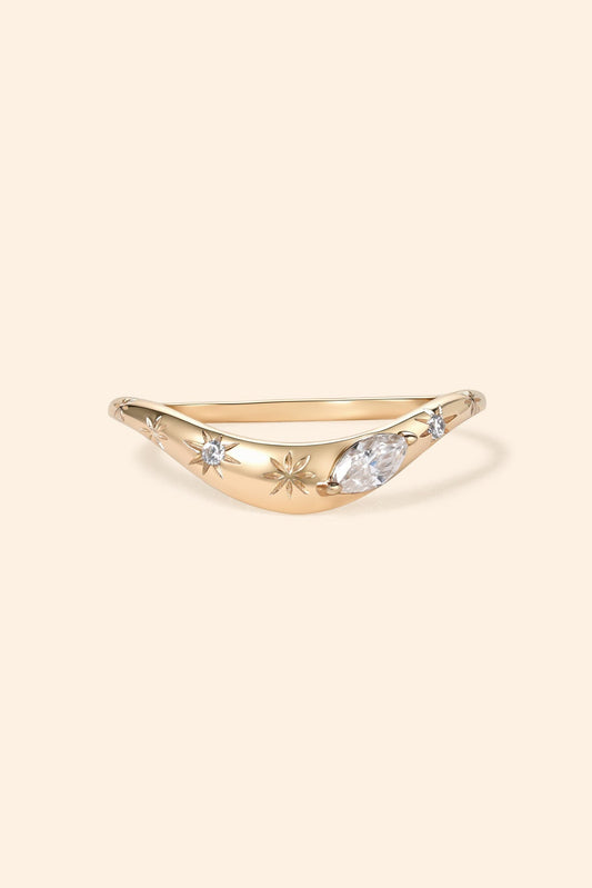 Gold curved celestial ring with marquise-cut Moissanite and engraved starburst details