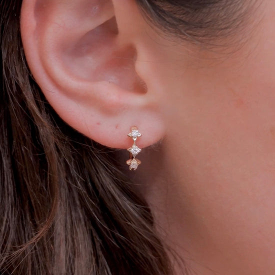 Dainty gold starlight huggie hoop earrings with sparkling moissanite by LIRAE