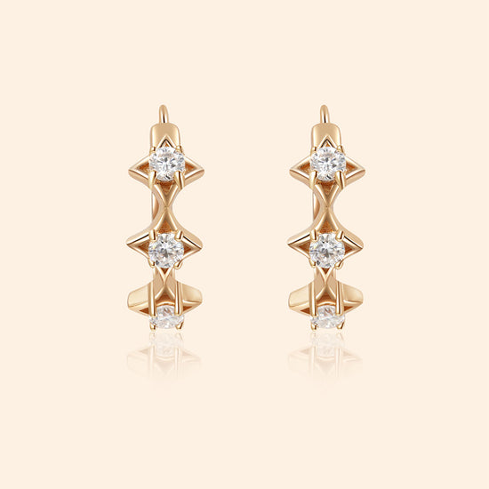 Dainty gold starlight huggie hoop earrings with sparkling moissanite by LIRAE