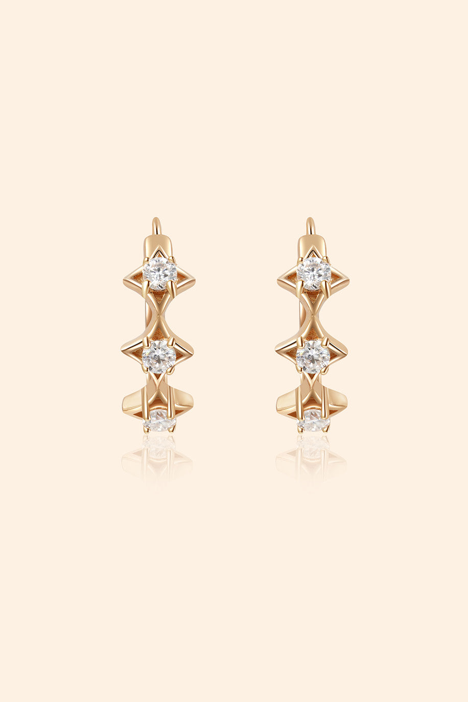 Dainty gold starlight huggie hoop earrings with sparkling moissanite by LIRAE