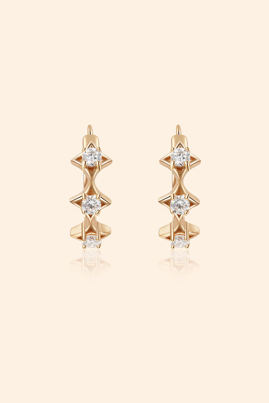 Dainty gold starlight huggie hoop earrings with sparkling moissanite by LIRAE