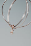Dainty gold starlight huggie hoop earrings with sparkling moissanite by LIRAE