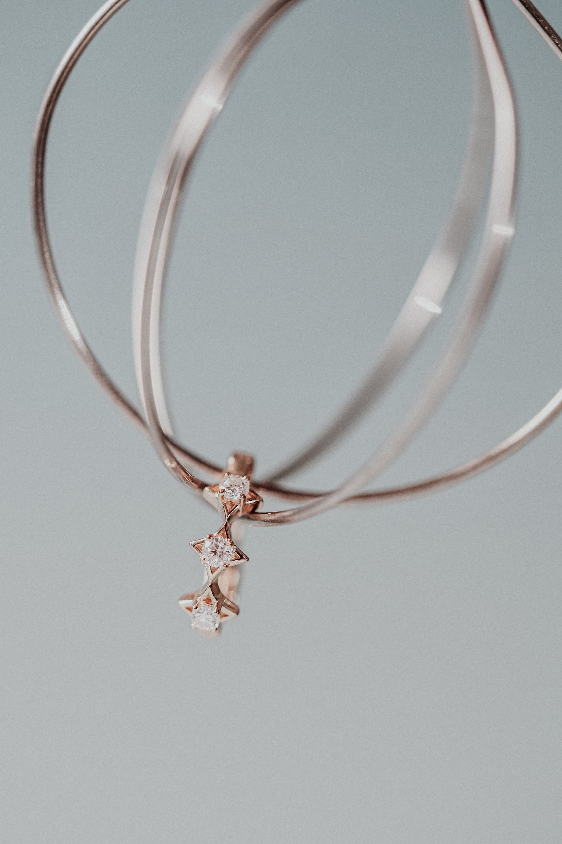 Dainty gold starlight huggie hoop earrings with sparkling moissanite by LIRAE