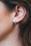Dainty silver starlight huggie hoop earrings with sparkling moissanites by LIRAE