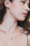 Dainty silver starlight huggie hoop earrings with sparkling moissanites by LIRAE